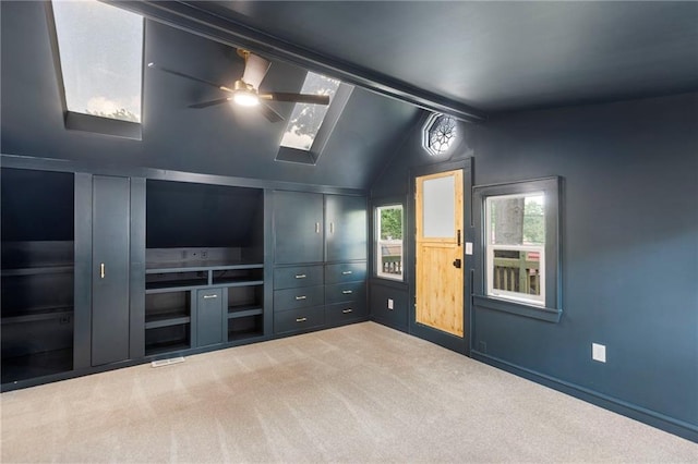 17 E 65th Ter, Kansas City, MO 64113 - unfurnished room with ceiling fan, a skylight, and carpet