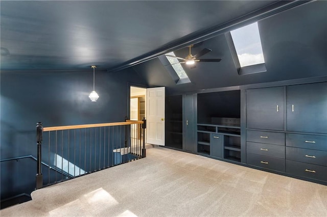 17 E 65th Ter, Kansas City, MO 64113 - carpeted empty room featuring a skylight, a ceiling fan, and vaulted ceiling