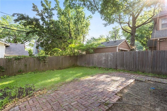 17 E 65th Ter, Kansas City, MO 64113 - fenced backyard with a patio