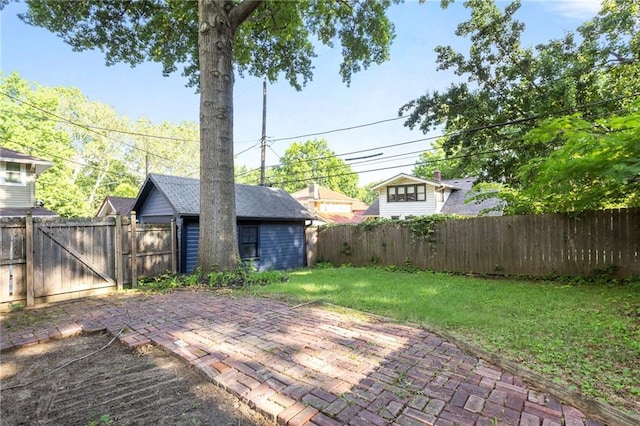 17 E 65th Ter, Kansas City, MO 64113 - fenced backyard featuring a patio area and a gate