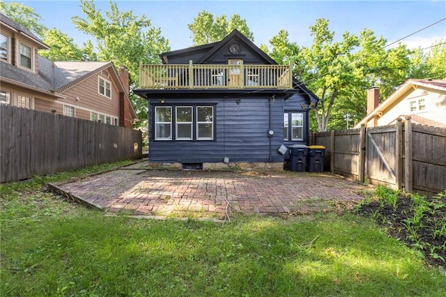 17 E 65th Ter, Kansas City, MO 64113 - back of property with a patio area and a fenced backyard
