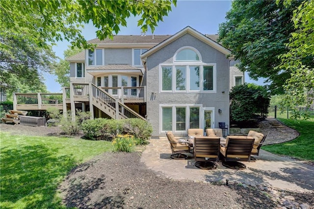 14911 Outlook Ln, Overland Park, KS 66223 - back of house featuring stairs, a deck, a patio area, and stucco siding