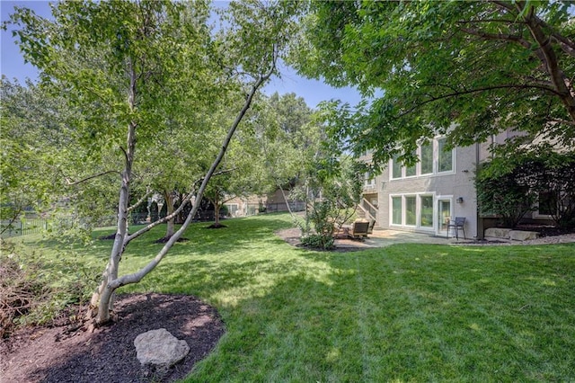 14911 Outlook Ln, Overland Park, KS 66223 - view of green lawn with a patio area