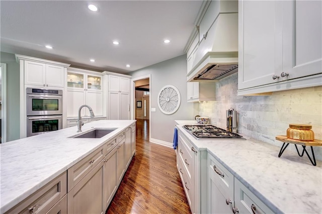 14911 Outlook Ln, Overland Park, KS 66223 - kitchen with stainless steel appliances, premium range hood, wood finished floors, recessed lighting, and tasteful backsplash