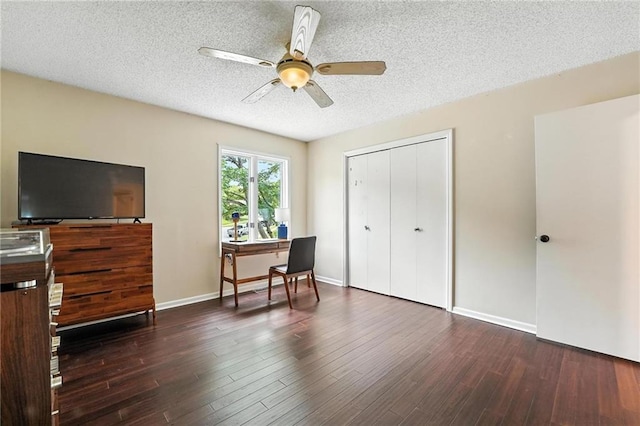 3437 N Wabash Ave, Kansas City, MO 64116 - bedroom featuring a closet, wood finished floors, a textured ceiling, and a ceiling fan