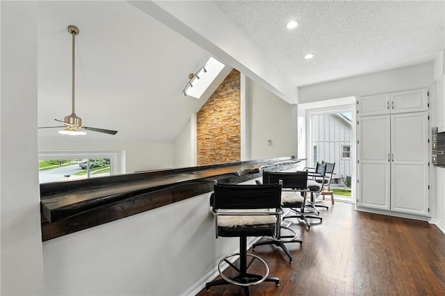 3437 N Wabash Ave, Kansas City, MO 64116 - office space featuring a textured ceiling, dark wood finished floors, lofted ceiling, ceiling fan, and recessed lighting