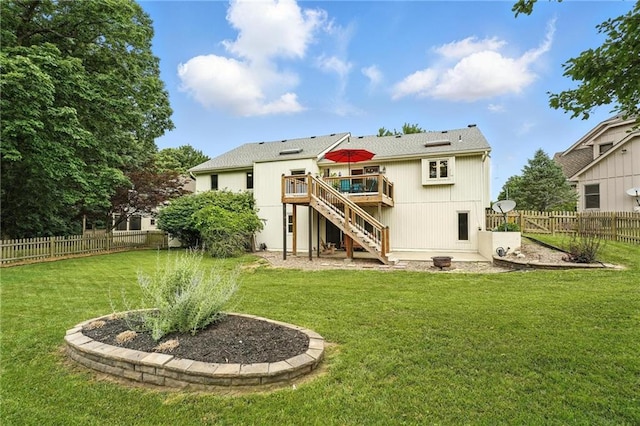 3437 N Wabash Ave, Kansas City, MO 64116 - back of house featuring stairway, a wooden deck, and a fenced backyard