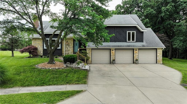 3437 N Wabash Ave, Kansas City, MO 64116 - view of front facade with stone siding, a front yard, a chimney, and driveway