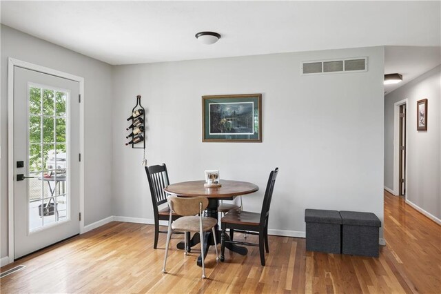 19109 Quinn Rd, Trimble, MO 64492 - dining area featuring wood finished floors and baseboards