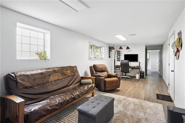19109 Quinn Rd, Trimble, MO 64492 - living room featuring wood finished floors and a desk