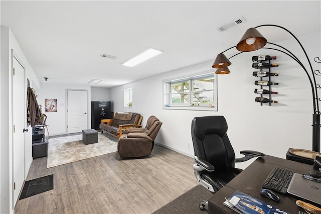 19109 Quinn Rd, Trimble, MO 64492 - home office with wood finished floors and baseboards