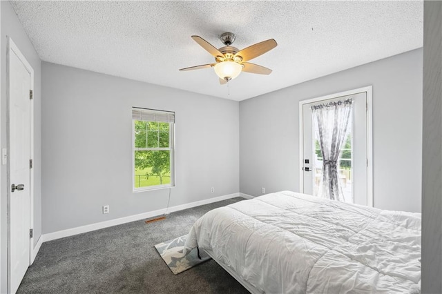 19109 Quinn Rd, Trimble, MO 64492 - carpeted bedroom with a textured ceiling, access to exterior, baseboards, and ceiling fan