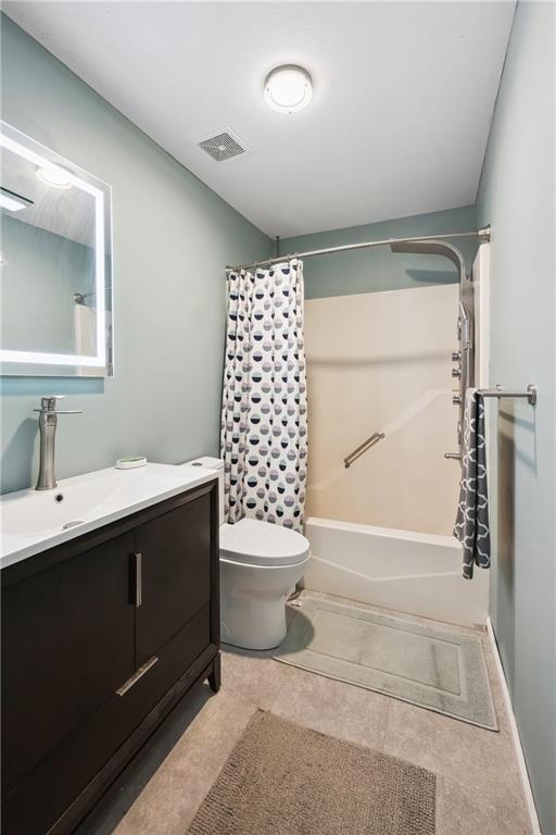 19109 Quinn Rd, Trimble, MO 64492 - full bath featuring vanity, shower / tub combo, and toilet