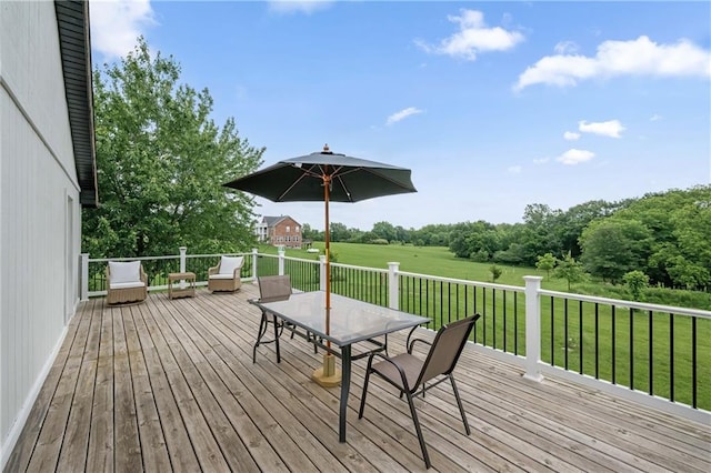 19109 Quinn Rd, Trimble, MO 64492 - wooden deck with outdoor dining area and a yard