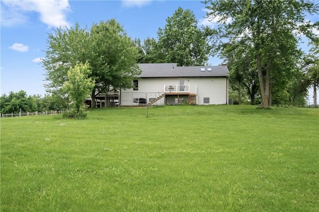 19109 Quinn Rd, Trimble, MO 64492 - rear view of property with stairway, a wooden deck, and a lawn