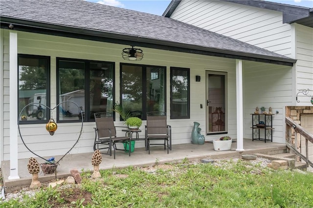 19109 Quinn Rd, Trimble, MO 64492 - back of house featuring a shingled roof and a porch