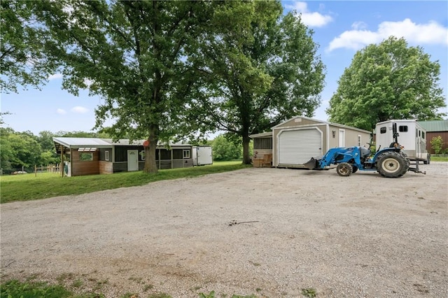 19109 Quinn Rd, Trimble, MO 64492 - view of front of property featuring a detached garage and an outdoor structure