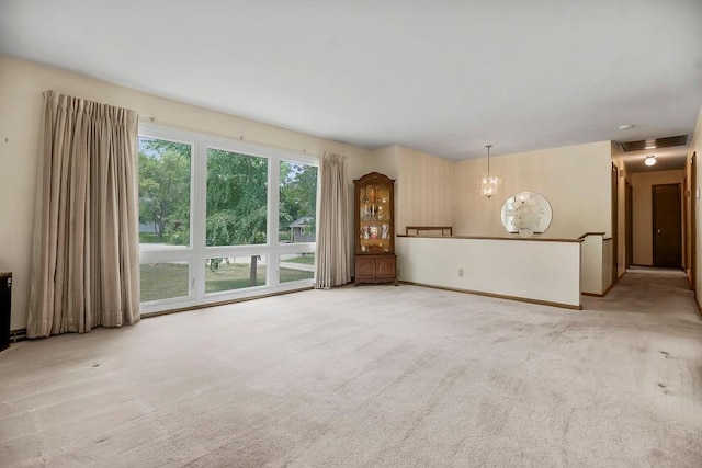 1310 N Leeview Cir, Olathe, KS 66061 - unfurnished living room with a chandelier and light carpet