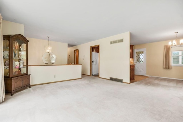 1310 N Leeview Cir, Olathe, KS 66061 - unfurnished living room with a chandelier and light carpet