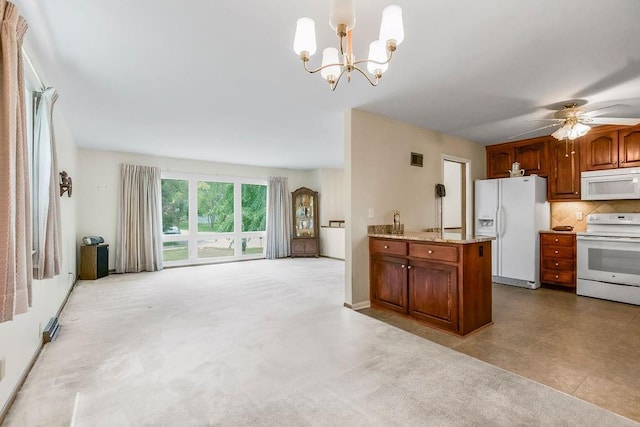 1310 N Leeview Cir, Olathe, KS 66061 - kitchen featuring white appliances, open floor plan, a chandelier, backsplash, and brown cabinets