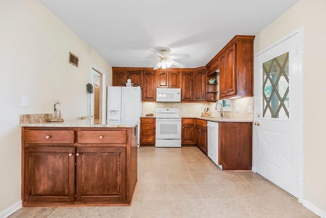 1310 N Leeview Cir, Olathe, KS 66061 - kitchen with white appliances, open shelves, ceiling fan, backsplash, and light stone countertops
