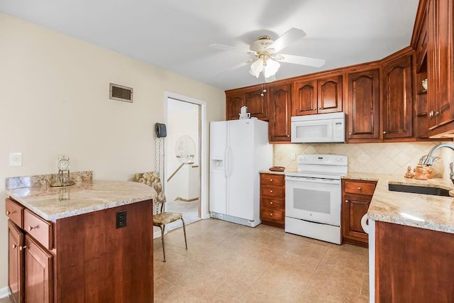 1310 N Leeview Cir, Olathe, KS 66061 - kitchen featuring white appliances, decorative backsplash, ceiling fan, and light stone counters