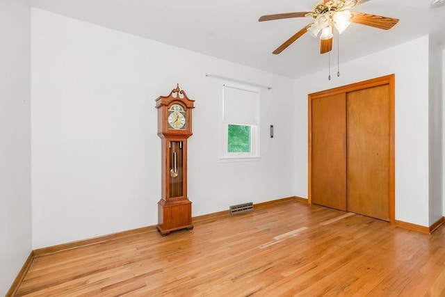 1310 N Leeview Cir, Olathe, KS 66061 - unfurnished bedroom featuring light wood-style floors, a closet, and ceiling fan