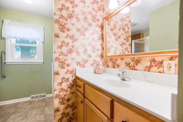 1310 N Leeview Cir, Olathe, KS 66061 - bathroom with vanity, an enclosed shower, tile patterned floors, and wallpapered walls