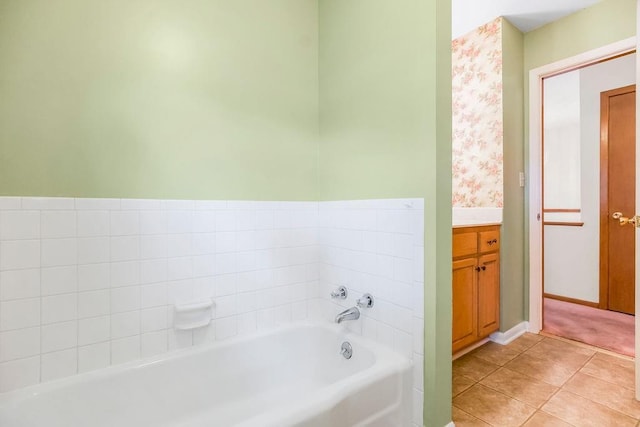 1310 N Leeview Cir, Olathe, KS 66061 - bathroom featuring a garden tub, vanity, and tile patterned flooring
