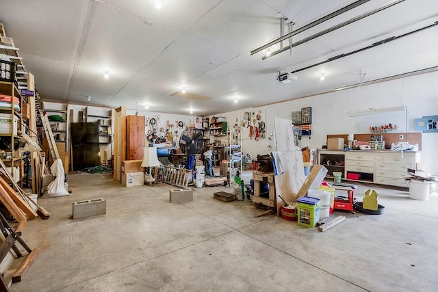 1310 N Leeview Cir, Olathe, KS 66061 - garage featuring a workshop area and a garage door opener