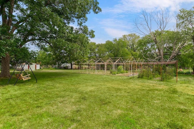 1310 N Leeview Cir, Olathe, KS 66061 - view of green lawn with a vegetable garden