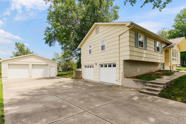 1310 N Leeview Cir, Olathe, KS 66061 - view of property exterior with a garage, brick siding, and an outbuilding