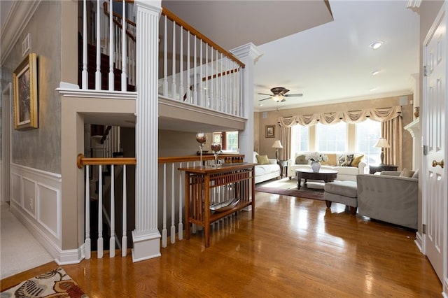 6501 N National Dr, Parkville, MO 64152 - staircase with a ceiling fan, wood finished floors, and ornamental molding