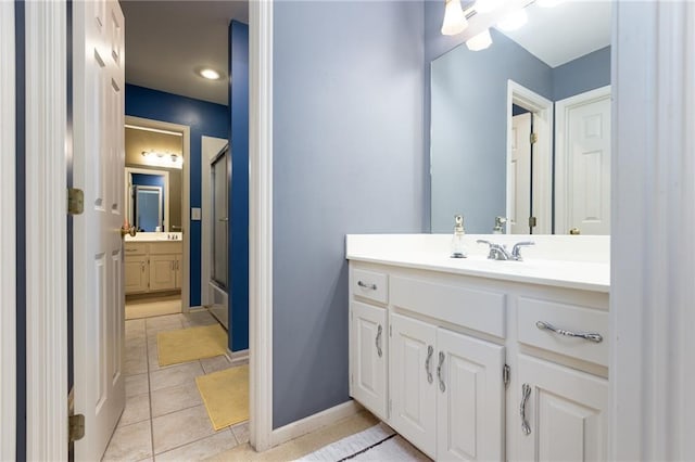 6501 N National Dr, Parkville, MO 64152 - full bathroom featuring a shower with door, tile patterned flooring, vanity, and baseboards