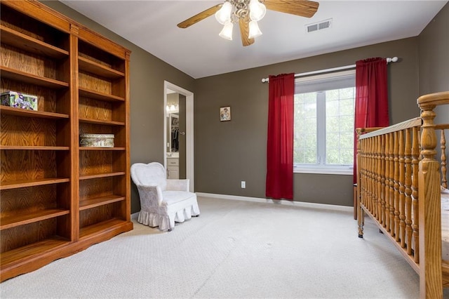 6501 N National Dr, Parkville, MO 64152 - living area with a ceiling fan, carpet, and baseboards