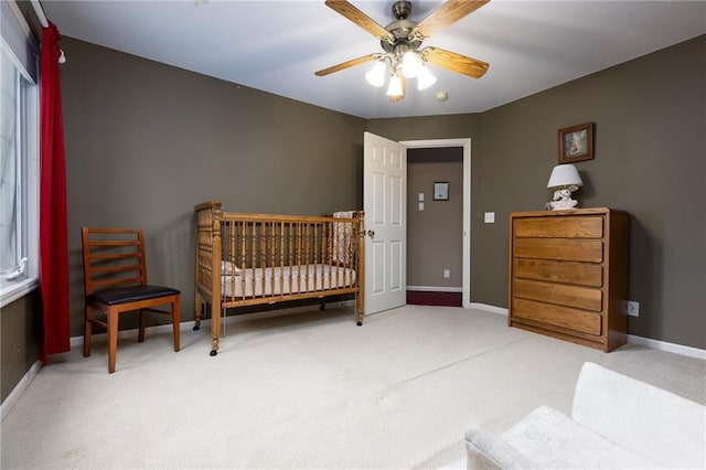 6501 N National Dr, Parkville, MO 64152 - bedroom featuring carpet floors, baseboards, and a ceiling fan