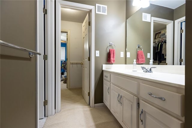 6501 N National Dr, Parkville, MO 64152 - bathroom featuring vanity and a spacious closet