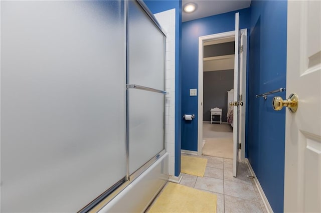 6501 N National Dr, Parkville, MO 64152 - ensuite bathroom with tile patterned floors, combined bath / shower with glass door, and baseboards