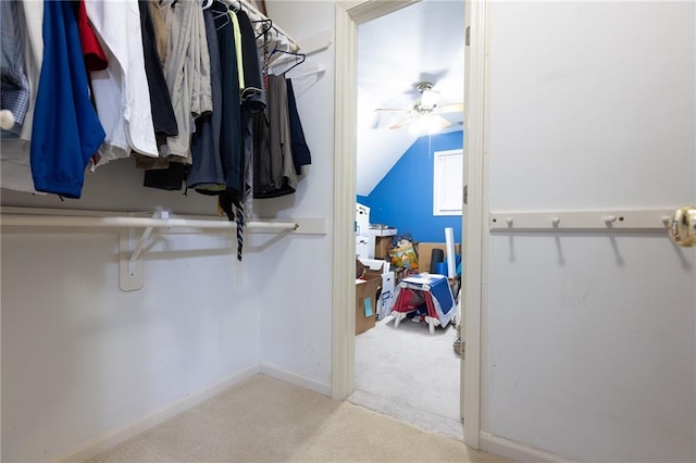 6501 N National Dr, Parkville, MO 64152 - walk in closet featuring carpet floors, ceiling fan, and vaulted ceiling