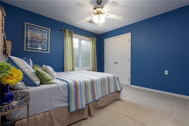 6501 N National Dr, Parkville, MO 64152 - carpeted bedroom with a closet, baseboards, and a ceiling fan