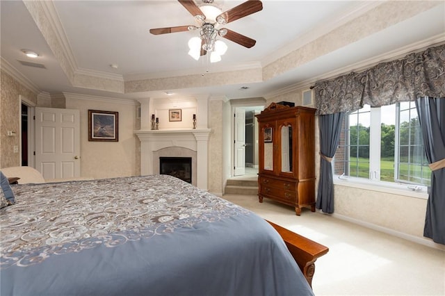 6501 N National Dr, Parkville, MO 64152 - bedroom featuring light colored carpet, crown molding, a large fireplace, a raised ceiling, and baseboards