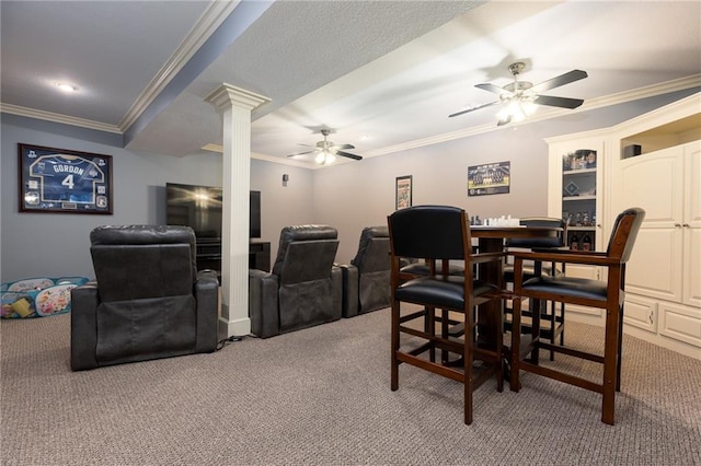 6501 N National Dr, Parkville, MO 64152 - home theater with light carpet, a ceiling fan, ornate columns, and ornamental molding