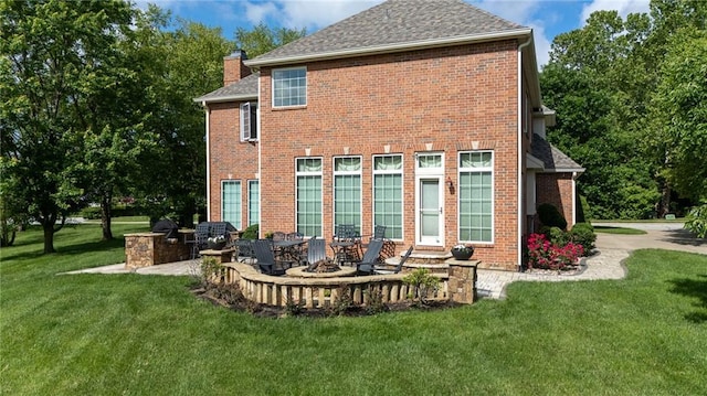 6501 N National Dr, Parkville, MO 64152 - rear view of property with a yard, a chimney, and brick siding