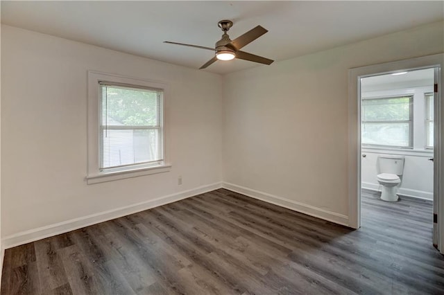 6117 Harrison St, Kansas City, MO 64110 - unfurnished room featuring dark wood finished floors, ceiling fan, and baseboards