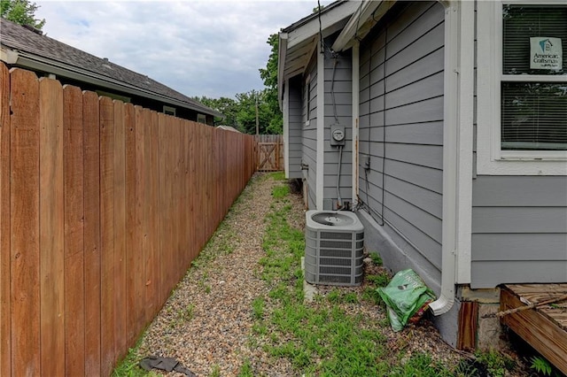 6117 Harrison St, Kansas City, MO 64110 - view of yard featuring central air condition unit