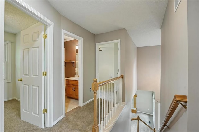 14876 S Summit St, Olathe, KS 66062 - corridor featuring an upstairs landing, light carpet, and a textured ceiling