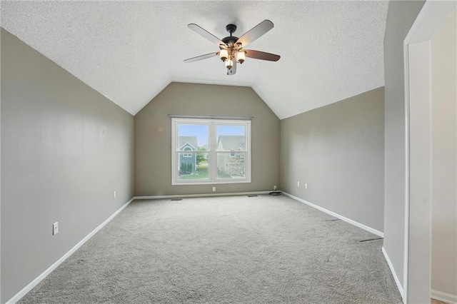 14876 S Summit St, Olathe, KS 66062 - bonus room featuring a ceiling fan, carpet, lofted ceiling, and a textured ceiling
