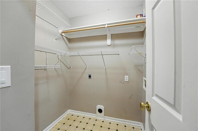 14876 S Summit St, Olathe, KS 66062 - laundry area featuring hookup for an electric dryer, tile patterned floors, and hookup for a washing machine
