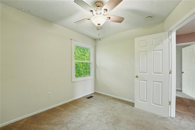 14876 S Summit St, Olathe, KS 66062 - unfurnished bedroom featuring carpet floors, a textured ceiling, and a ceiling fan