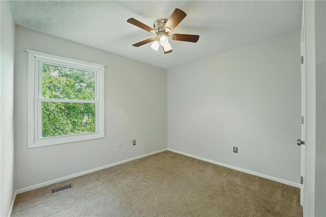 14876 S Summit St, Olathe, KS 66062 - unfurnished room featuring carpet floors, ceiling fan, and a textured ceiling